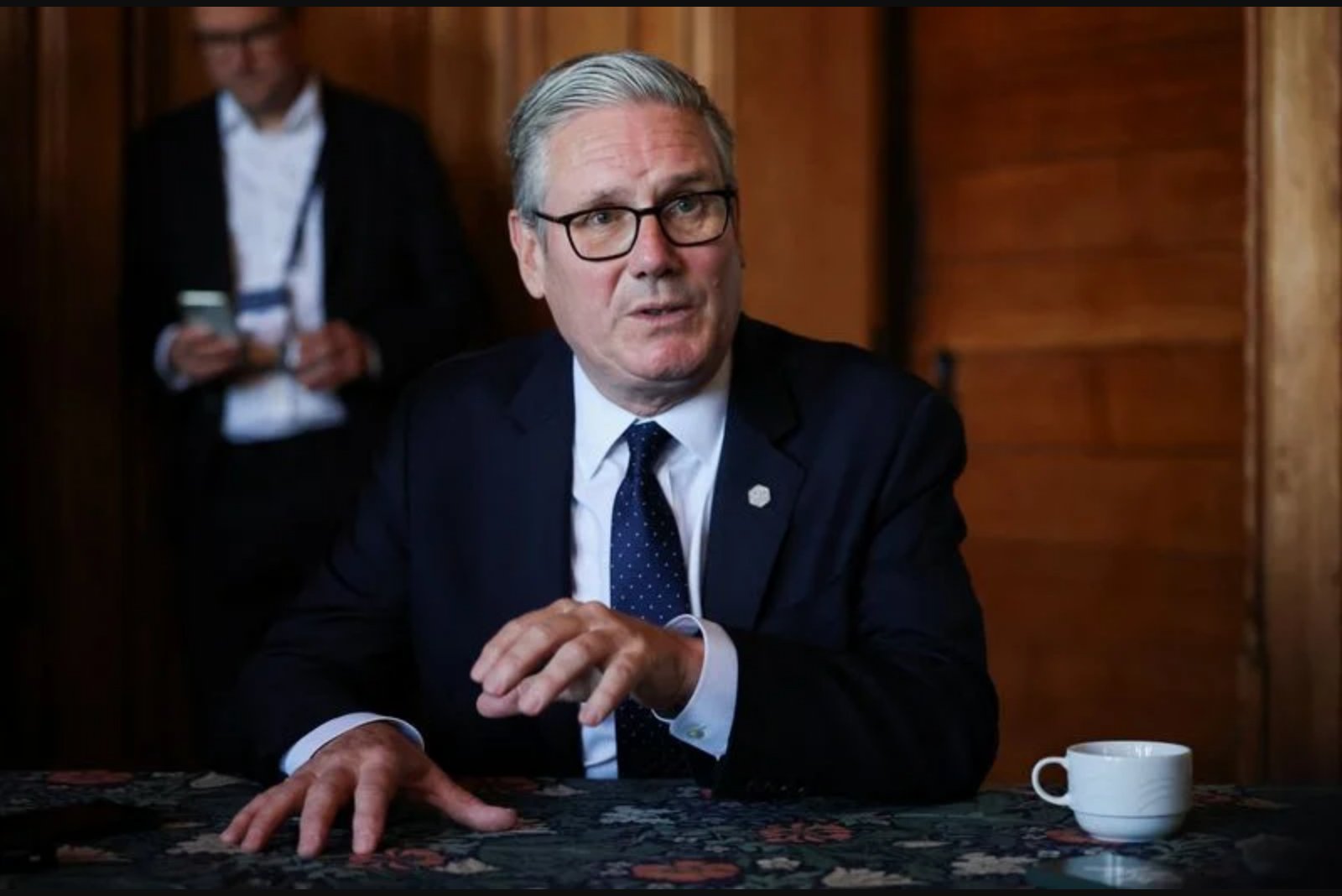 Business minister says he sees no sign Prime Minister will quit on Monday