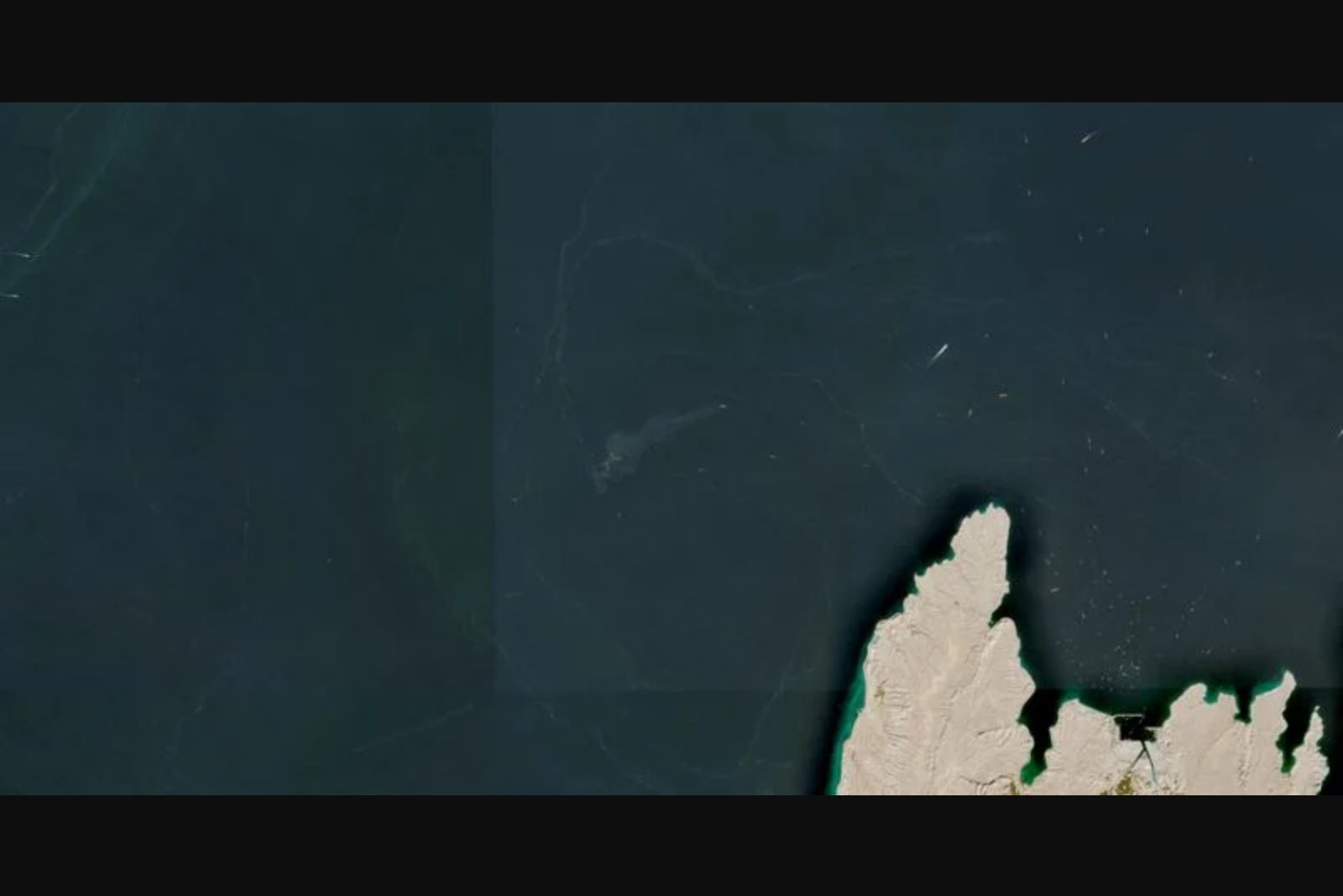 Two Commercial Vessels Sink Near Strait of Hormuz After Projectile Strikes