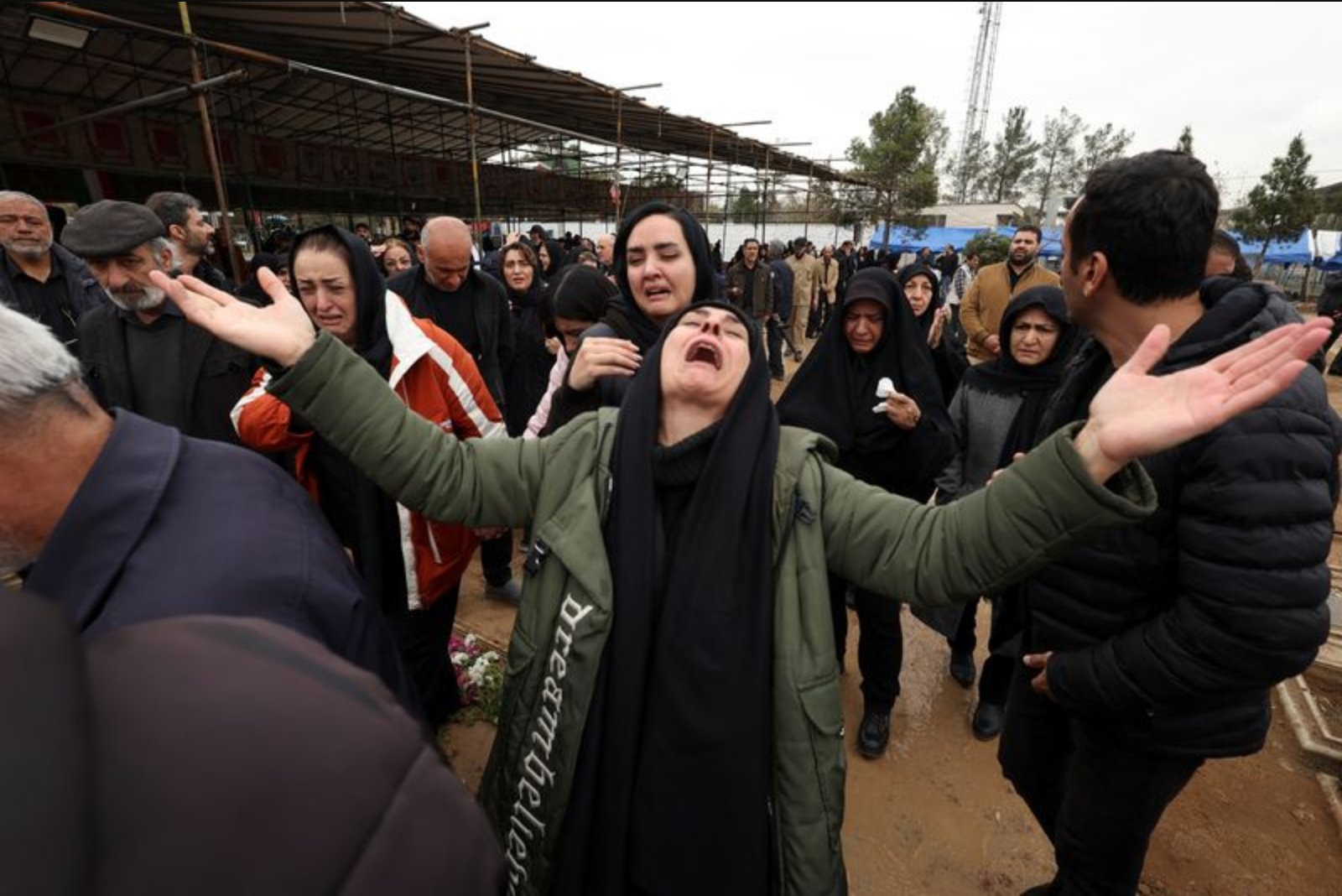 Mourners in Tehran Lay to Rest War Dead as Air Strikes Echo Over Cemetery